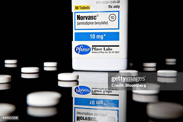 Pills of Pfizer Inc.'s blood pressure drug Norvasc are arranged for a photo at New London Pharmacy in New York, U.S., on Wednesday, July 22, 2009....