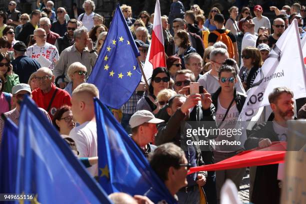 People with Polish and EU flags are seen in Gdansk, Poland on 21 April 2018 Houndreds of people gathered in front of old City Hall in Gdansk, to...