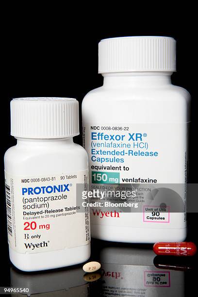 Wyeth's depression treatment Effexor, the company's top-seller, right, and Wyeth's acid reflux drug Protonix are arranged for a photo at New London...