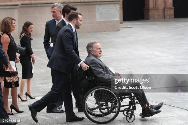 Former president George H.W. Bush leaves the funeral service of former first lady Barbara Bush at St. Martin's Episcopal Church on April 21, 2018 in...