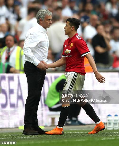Manchester United manager Jose Mourinho shakes hands with Alexis Sanchez as he is substituted off the pitch during the Emirates FA Cup semi-final...