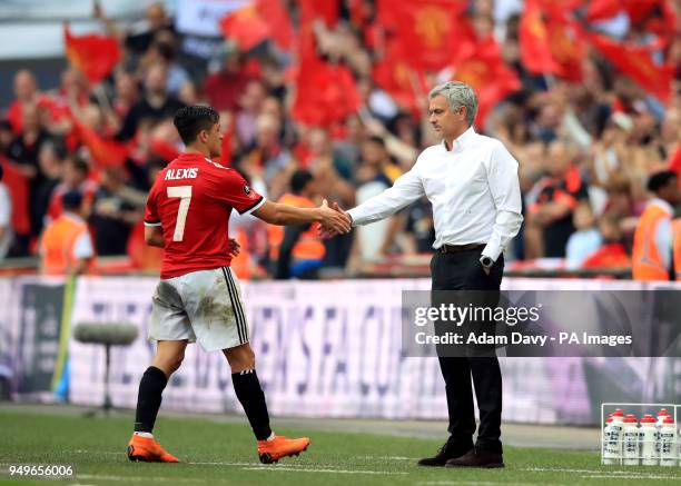 Manchester United's Alexis Sanchez and manager Jose Mourinho during the Emirates FA Cup semi-final match at Wembley Stadium, London.