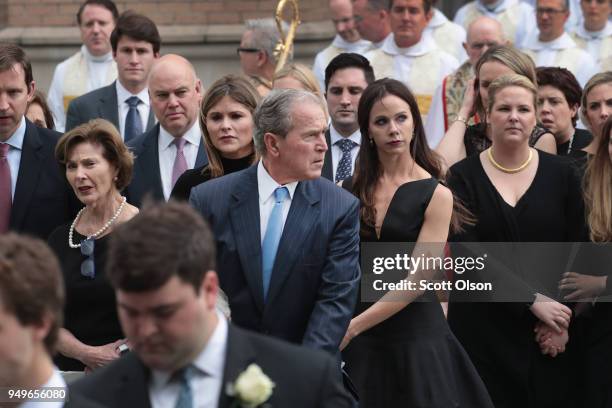 Former president George W. Bush and family follow as the remains of former first lady Barbara Bush are carried from St. Martin's Episcopal Church...