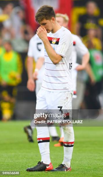 Leverkusen's Greek defender Panagiotis Retsos reacts after the German first division Bundesliga football match Borussia Dortmund vs Bayer Leverkusen,...