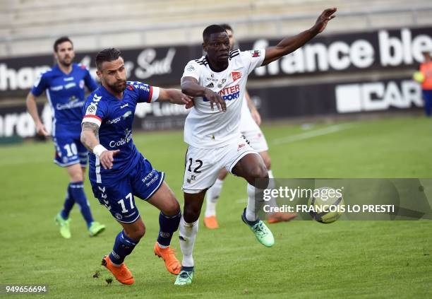 Amiens' French defender Bakaye Dibassy vies for the ball with Strasbourg's French midfielder Anthony Goncalves during the French L1 football match...