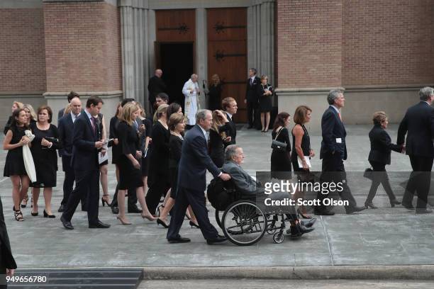 Former president George H.W. Bush and son, former president George W. Bush and family leave St. Martin's Episcopal Church following the funeral...