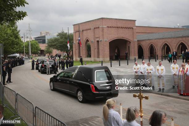 The remains of former first lady Barbara Bush leave St. Martin's Episcopal Church following her funeral service on April 21, 2018 in Houston, Texas....