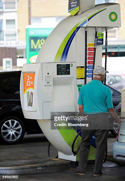 Customer fills their vehicle with fuel at a BP gas station in London, U.K., on Tuesday, July 28, 2009. BP Plc, Europe?s second-biggest oil company,...