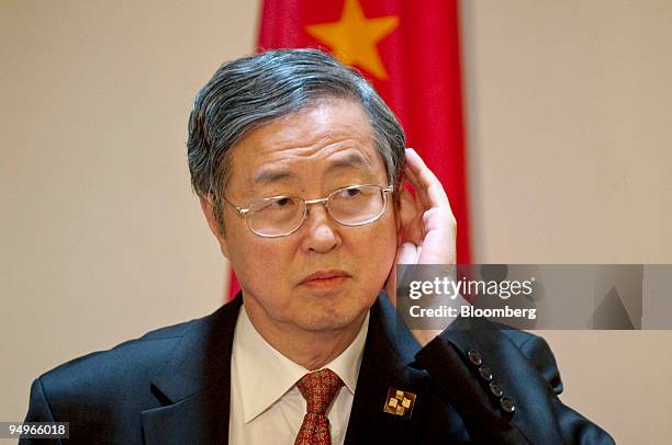 Zhou Xiaochuan, governor of China's central bank, listens during a news conference at the U.S.-China Strategic and Economic Dialogue in Washington,...