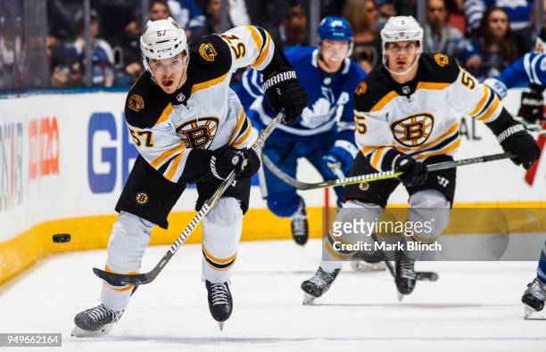 Tommy Wingels and Noel Acciari of the Boston Bruins skate against the Toronto Maple Leafs in Game Four of the Eastern Conference First Round during...