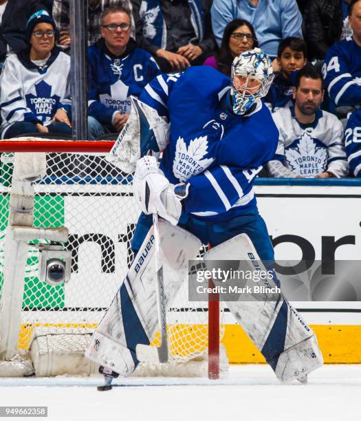 Frederik Andersen of the Toronto Maple Leafs plays the puck against the Boston Bruins in Game Four of the Eastern Conference First Round during the...