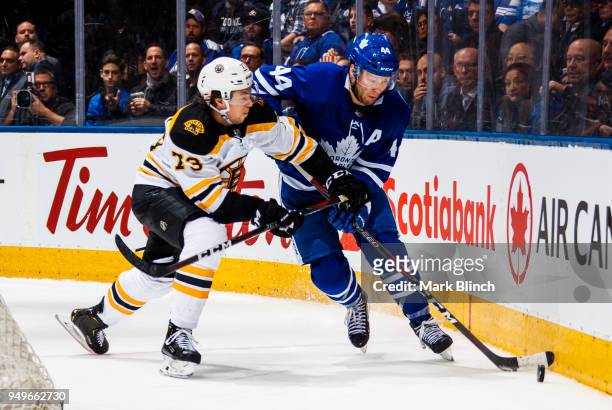 Morgan Rielly of the Toronto Maple Leafs skates against Charlie McAvoy of the Boston Bruins in Game Four of the Eastern Conference First Round during...
