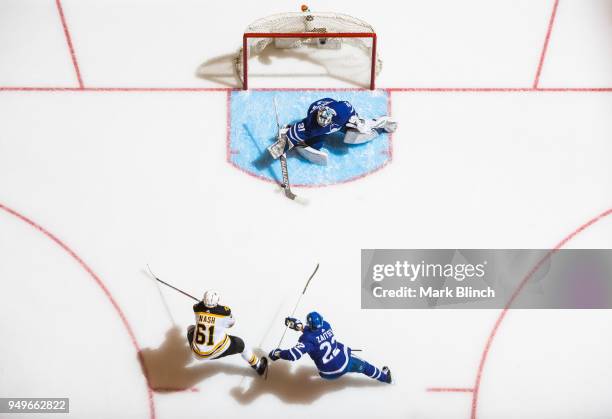 Rick Nash of the Boston Bruins goes to the net against Frederik Andersen and Nikita Zaitsev of the Toronto Maple Leafs in Game Four of the Eastern...