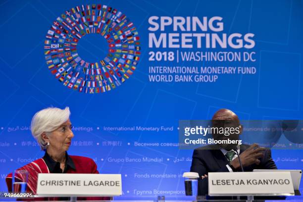 Lesetja Kganyago, governor of South Africa's reserve bank, right, speaks as Christine Lagarde, managing director of the International Monetary Fund ,...