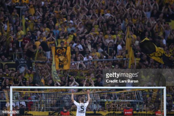 Sven Bender of Bayer Leverkusen applauds the Dortmund supporters as they cheer him, after the Bundesliga match between Borussia Dortmund and Bayer 04...