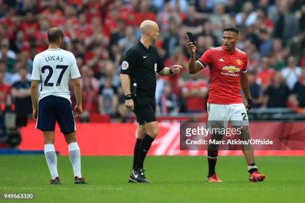 Referee: Anthony Taylor urges Luis Antonio Valencia of Manchester United to make a swift exit as he is substituted during The Emirates FA Cup Semi...
