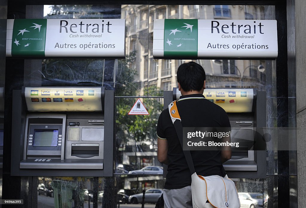 A customer uses a BNP Paribas ATM at one of the bank's branc