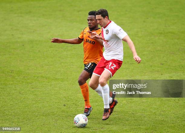 Shaquile Coulthirst of Barnet FC and Ben Tozer of Newport County AFC in action during the Sky Bet League Two match between Barnet FC and Newport...