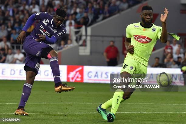 Toulouse's French forward Yaya Sanogo vies with Angers' Ivorian defender Ismael Traore during the French L1 football match Toulouse against Angers...