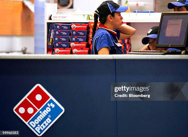 Worker takes an order at a Domino's Pizza restaurant in Mexico City, Mexico, on Thursday, Aug. 6, 2009. Domino's Pizza, the second-largest U.S. Pizza...