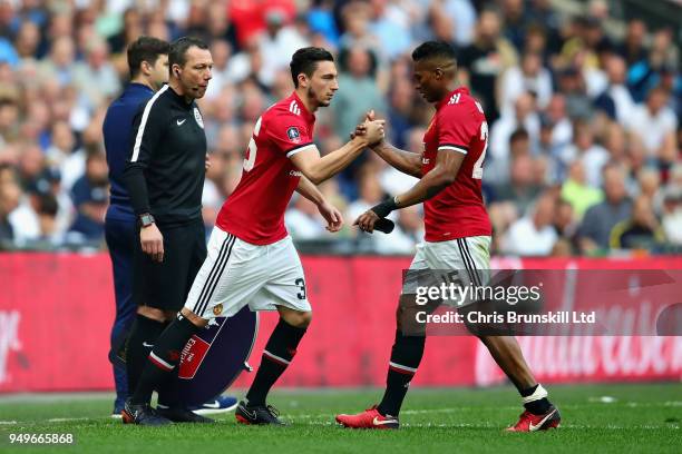 Antonio Valencia of Manchester United is replaced as a substitute by teammate Matteo Darmian during The Emirates FA Cup Semi Final match between...