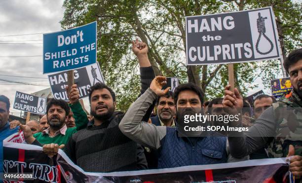 Kashmir Muslims hold placards and chant slogans during a protest in Srinagar, the summer capital of Indian administered Kashmir. Protesters staged...