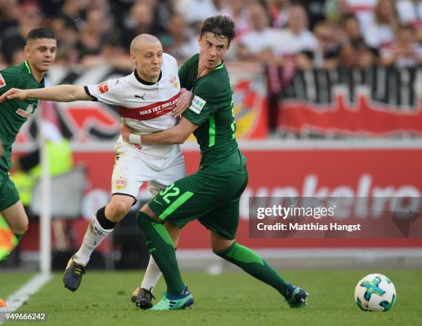 Santiago Ascacibar of Stuttgart is challenged by Marco Friedl of Bremen during the Bundesliga match between VfB Stuttgart and SV Werder Bremen at...