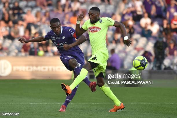 Toulouse's French defender Issa Diop vies with Angers' Cameroonian forward Karl Toko Ekambi during the French L1 football match Toulouse against...