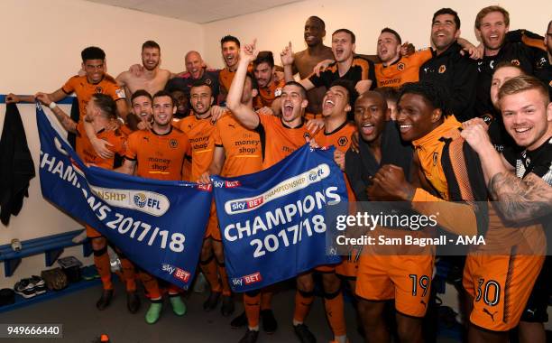 Players of Wolverhampton Wanderers celebrate winning the Championship during the Sky Bet Championship match between Bolton Wanderers and...