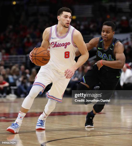 Zach LaVine of the Chicago Bulls moves past Yogi Ferrell of the Dallas Mavericks at the United Center on March 2, 2018 in Chicago, Illinois. The...