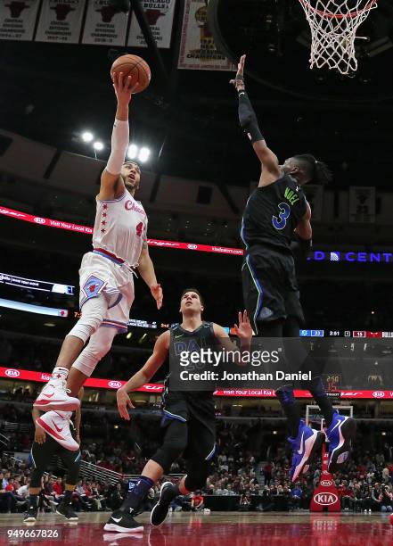 Denzel Valentine of the Chicago Bulls puts up a shot against Doug McDermott and Nerlens Noel of the Dallas Mavericks at the United Center on March 2,...