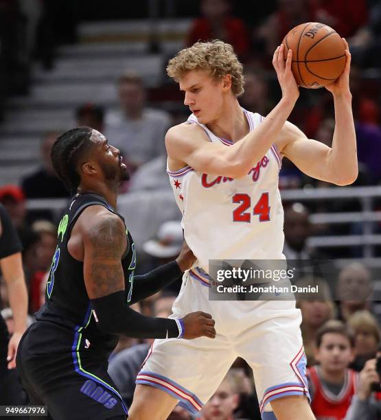 Lauri Markkanen of the Chicago Bulls looks to move against Wesley Matthews of the Dallas Mavericks at the United Center on March 2, 2018 in Chicago,...