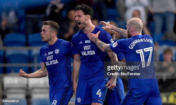 Sean Morrison of Cardiff celebrates with team mates after scoring the opening goal during the Sky Bet Championship match between Cardiff City and...
