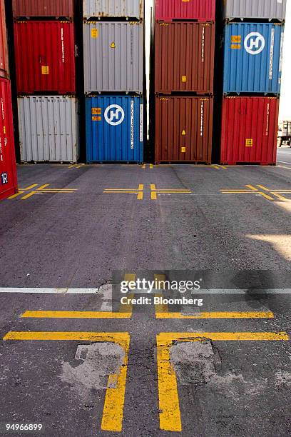 Sign marks a vacant spot next to stacked containers at the Georgia Port Authority's Garden City terminal in Garden City, Georgia, U.S., on Wednesday,...
