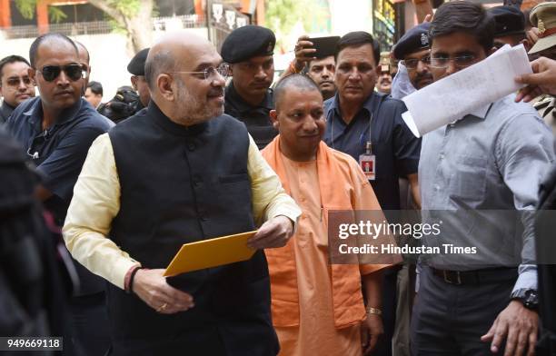 National President Amit Shah along with UP Chief Minister Yogi Adityanath arrives at BJP Party office on April 21, 2018 in Lucknow, India.