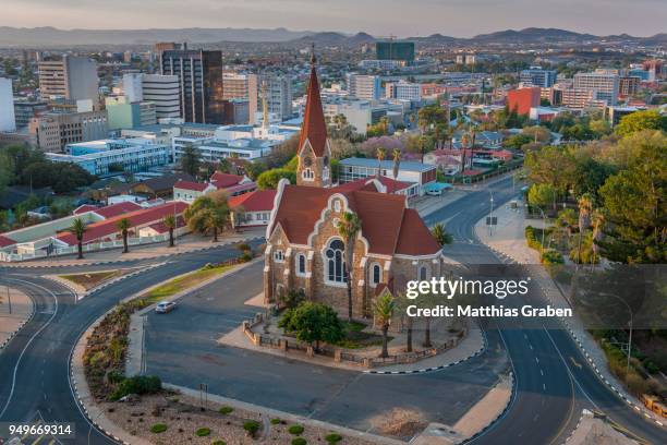 evangelical lutheran christ church of 1910 with an overview of the city, windhoek, namibia - windhoek stock pictures, royalty-free photos & images