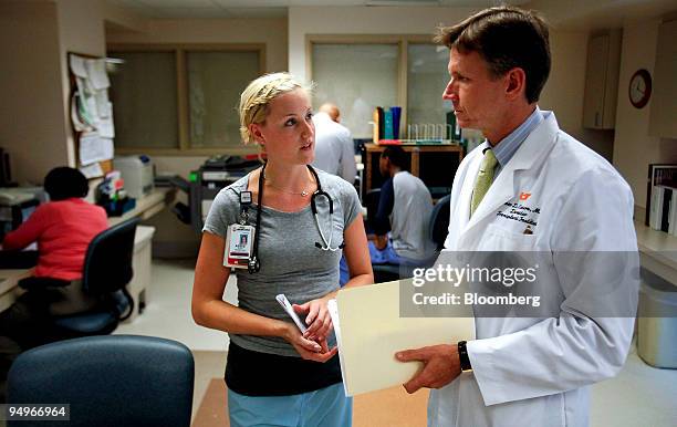 James Eason, chief of transplantation at Methodist University Hospital, right, speaks with nurse Abbie Peters in the hospital's transplant ward in...