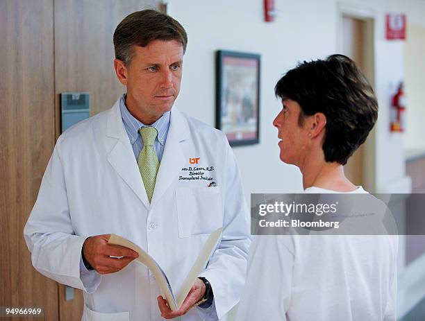 James Eason, chief of transplantation at Methodist University Hospital, left, speaks with nurse Sharie Lewis in the hospital's transplant ward in...