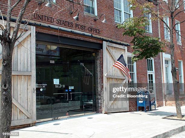 Flag flies outside the Fell's Point Post Office in Baltimore, Maryland, U.S., on Aug. 18, 2009. Arthur Perschetz, president of the Fell?s Point...