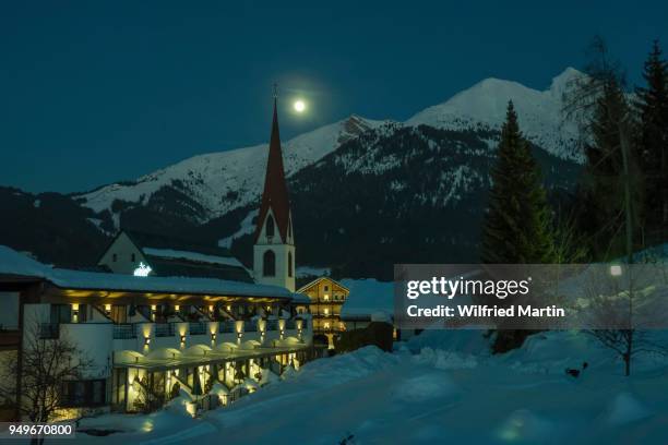 st. oswald parish church, seefeld, at full moon, with seefelder spitze, haermelekopf and reither spitze, tyrol, austria - spitze stock pictures, royalty-free photos & images