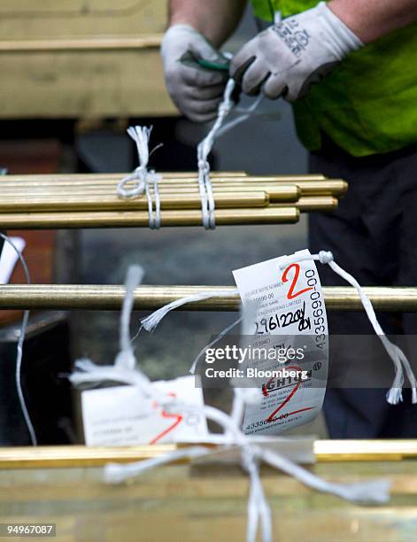 Employees assemble an order of brass rods at Righton metal distributors in Birmingham, U.K., on Wednesday, Aug. 19, 2009. Copper rose from a two-week...