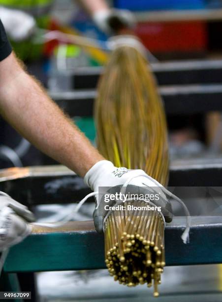 Employees assemble an order of brass rods at Righton metal distributors in Birmingham, U.K., on Wednesday, Aug. 19, 2009. Copper rose from a two-week...