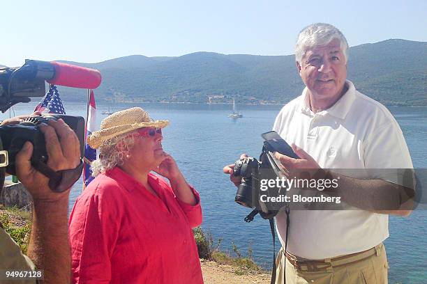 Robert Benmosche, president and chief executive officer of American International Group , right, and his wife Denise, speak during an interview at...