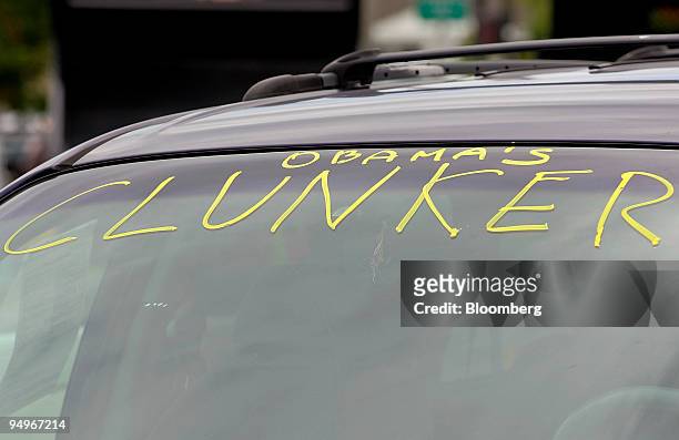 Sign reading "Obama's Clunker" is displayed on a vehicle traded in through the "cash for clunkers" program at Bredemann Toyota dealership in Park...