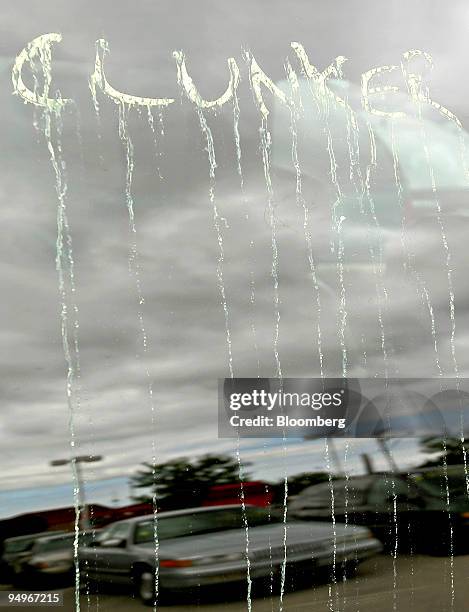 The paint marking a vehicle traded in through the "cash for clunkers" program runs on a car window at Bredemann Toyota dealership in Park Ridge,...