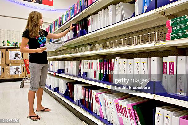Kayla Schiwart who is about to start 10th grade, looks at binders while shopping for school supplies at a Super Target store in Littleton, Colorado,...