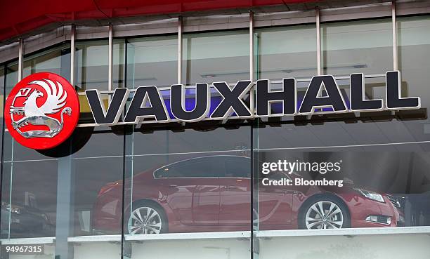 New Vauxhall Insignia automobile sits on display at a dealership in Luton, U.K., on Wednesday, Sept. 9, 2009. General Motors Co. Has made a decision...