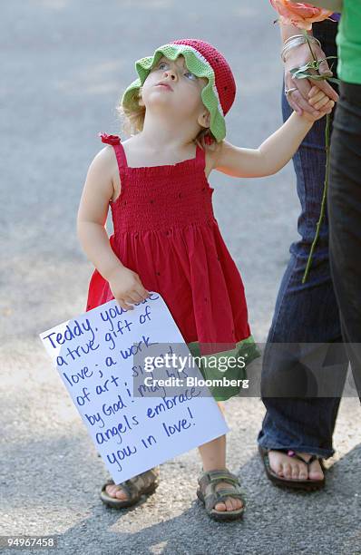 Rylee Theis accompanies her mother, April, to pay respects to the late Senator Edward M. "Ted" Kennedy near the Kennedy family's Cape Cod compound in...