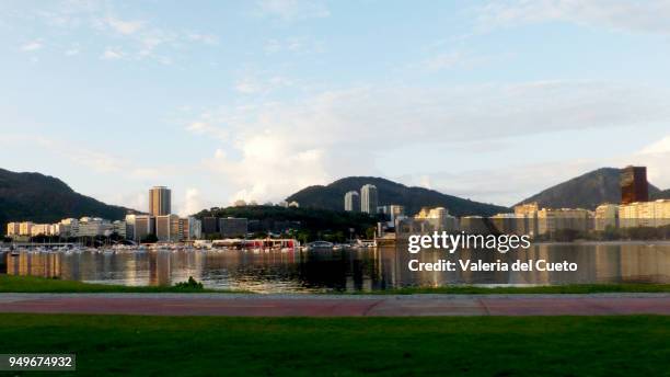 in the cove of botafogo the reflection of the buildings of urca at dawn - valeria del cueto stock pictures, royalty-free photos & images