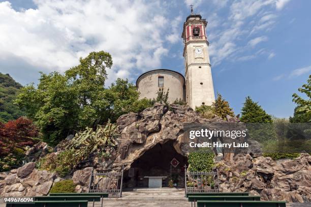 st. georg parish church, below a replica of the grotto of lourdes, mariengrotte, cannero riviera, lago maggiore, verbano-cusio-ossola province, piedmont region, italy - province of verbano cusio ossola stock pictures, royalty-free photos & images